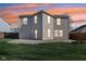 Spacious backyard featuring green grass, a concrete patio, and tasteful string lights at 10303 Memorial Knoll Dr, Indianapolis, IN 46234