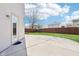 Spacious backyard featuring a concrete patio, wood fence, and a well-maintained lawn at 10303 Memorial Knoll Dr, Indianapolis, IN 46234