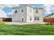 Home exterior, showing concrete patio, exterior lights, and lawn at 10303 Memorial Knoll Dr, Indianapolis, IN 46234