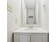 Bathroom featuring a sink with mirror and a white cabinet, offering a clean, minimalist space at 10303 Memorial Knoll Dr, Indianapolis, IN 46234