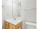 Bathroom with a wooden vanity with modern fixtures, a toilet, and a large mirror at 10303 Memorial Knoll Dr, Indianapolis, IN 46234