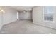 Spacious bedroom features neutral walls, carpet, ceiling fan, and a sunlit window at 10303 Memorial Knoll Dr, Indianapolis, IN 46234