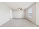 Spacious carpeted bedroom with a ceiling fan, and a sunlit window at 10303 Memorial Knoll Dr, Indianapolis, IN 46234