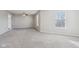A spacious bedroom with carpeting, two windows, and a ceiling fan at 10303 Memorial Knoll Dr, Indianapolis, IN 46234