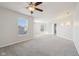Bright bedroom with a ceiling fan and two windows, offering scenic views at 10303 Memorial Knoll Dr, Indianapolis, IN 46234