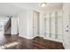 Bright entryway featuring wood floors, coat rack with hooks, and staircase to the upper level at 10303 Memorial Knoll Dr, Indianapolis, IN 46234