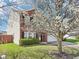 Charming two-story home with brick and siding, black shutters, and a well-manicured lawn at 10303 Memorial Knoll Dr, Indianapolis, IN 46234