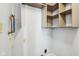 Laundry room with hanging shelves and hookups for a washer and dryer at 10303 Memorial Knoll Dr, Indianapolis, IN 46234