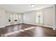 Spacious living room with wood floors and natural light coming through the large windows at 10303 Memorial Knoll Dr, Indianapolis, IN 46234
