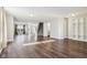 Large living room features wood floors, staircase, and connects seamlessly with other rooms at 10303 Memorial Knoll Dr, Indianapolis, IN 46234