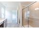 Modern bathroom featuring shower, double sink vanity, with neutral walls and tile flooring at 1038 Stubble Run, Danville, IN 46122