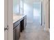 Modern bathroom featuring double sink vanity, with walk in shower and tile flooring at 1038 Stubble Run, Danville, IN 46122