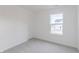 Bedroom with neutral carpet, door and bright window at 1038 Stubble Run, Danville, IN 46122