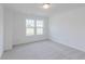 Bright bedroom features neutral carpet, trim and paint and a scenic view from the window at 1038 Stubble Run, Danville, IN 46122