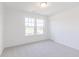 Bright bedroom with white walls, carpet, and window at 1038 Stubble Run, Danville, IN 46122