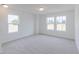 Bright bedroom with plush carpet and multiple windows at 1038 Stubble Run, Danville, IN 46122
