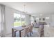 Dining room includes sliding glass doors overlooking the property's grounds, letting in plenty of natural light at 1038 Stubble Run, Danville, IN 46122