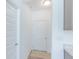 Bright entryway with white walls, light colored floor, and a door leading outside at 1038 Stubble Run, Danville, IN 46122