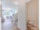 Welcoming entryway with light wood flooring, access to a powder room, and view of the living area at 1038 Stubble Run, Danville, IN 46122