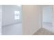 Bright hallway leading to a bedroom featuring natural lighting at 1038 Stubble Run, Danville, IN 46122