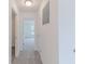Bright hallway with neutral carpet and white walls creates a clean and modern feel at 1038 Stubble Run, Danville, IN 46122