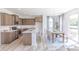 Open concept view of the eat-in kitchen with adjacent dining area and lots of natural light at 1038 Stubble Run, Danville, IN 46122