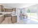 Open concept eat-in kitchen view with an adjacent dining area and sliding glass doors to the backyard at 1038 Stubble Run, Danville, IN 46122
