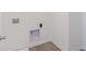 Laundry room featuring water hook-ups and dark tile at 1038 Stubble Run, Danville, IN 46122