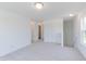 Bright living room features neutral carpet, trim and paint and entries to other rooms at 1038 Stubble Run, Danville, IN 46122