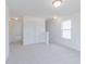 Bright living room features neutral carpet, trim and paint and a scenic view from the window at 1038 Stubble Run, Danville, IN 46122