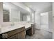 Bathroom featuring dual sinks, tile floors, quartz countertop and a large mirror at 1056 Stubble Run, Danville, IN 46122