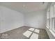 A bright bedroom with a window, door, and neutral carpet at 1056 Stubble Run, Danville, IN 46122