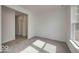Bright, carpeted bedroom featuring natural light and ample space, perfect for relaxation and rest at 1056 Stubble Run, Danville, IN 46122