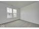 Cozy carpeted bedroom featuring large windows providing natural light and a peaceful atmosphere at 1056 Stubble Run, Danville, IN 46122