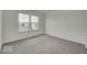 Carpeted bedroom with neutral walls and windows for ample natural light at 1056 Stubble Run, Danville, IN 46122