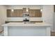 Bright kitchen featuring granite countertops, stainless steel appliances, and a center island with sink at 1056 Stubble Run, Danville, IN 46122