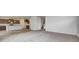 Open concept view of kitchen and living space with updated appliances, island, and hardwood floors at 1056 Stubble Run, Danville, IN 46122