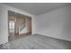 Spacious living room with neutral carpet and open access to the hallway and staircase at 1056 Stubble Run, Danville, IN 46122