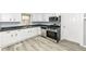 The newly updated kitchen features stainless steel appliances, sleek countertops, and ample cabinet space at 121 Illinois St, Shirley, IN 47384