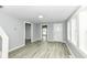 View of a living room with hardwood floors and neutral wall colors, offering a versatile space at 121 Illinois St, Shirley, IN 47384