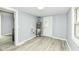 Utility room with light gray paint, white trim, vinyl floors, water heater, and access door to exterior at 121 Illinois St, Shirley, IN 47384