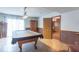 Basement featuring a pool table and wood paneled walls at 12166 N Bray Rd, Mooresville, IN 46158