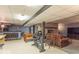 Finished basement featuring a bar, rec area, and stone fireplace at 12166 N Bray Rd, Mooresville, IN 46158