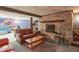 Cozy basement living area with stone fireplace and entertainment space at 12166 N Bray Rd, Mooresville, IN 46158