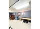 Finished basement with a variety of entertainment options, including a shuffleboard table and piano at 12166 N Bray Rd, Mooresville, IN 46158