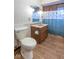 Bathroom featuring a toilet, patterned shower curtain, and vanity at 12166 N Bray Rd, Mooresville, IN 46158
