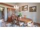 Dining area featuring hardwood floors, a chandelier, and a wooden china cabinet to display decor at 12166 N Bray Rd, Mooresville, IN 46158