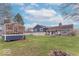 Spacious backyard with greenhouse, well, and landscaping at 12166 N Bray Rd, Mooresville, IN 46158