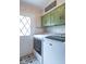 Laundry room featuring modern washer and dryer, tile floor and exterior door to the outside at 12166 N Bray Rd, Mooresville, IN 46158