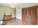 Well-lit living room with classic decor, hardwood floors, and functional closet space at 12166 N Bray Rd, Mooresville, IN 46158